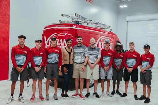 The Vibrant Mobile Detail team in front of a company service van