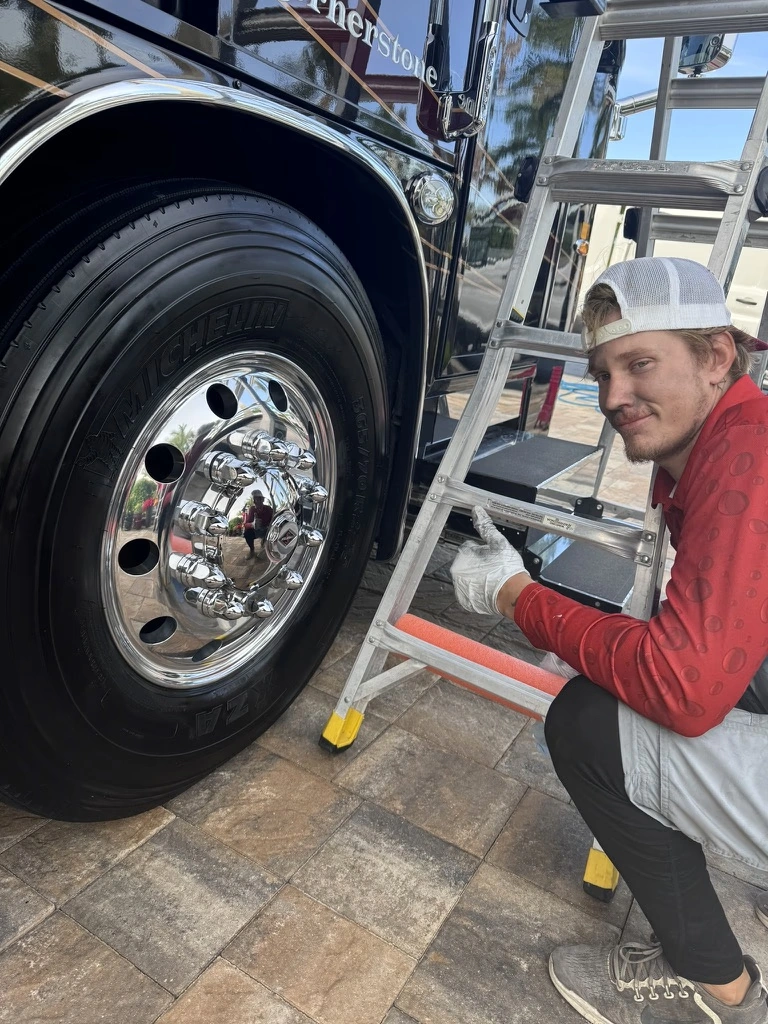 Polished aluminum wheels on a motorcoach